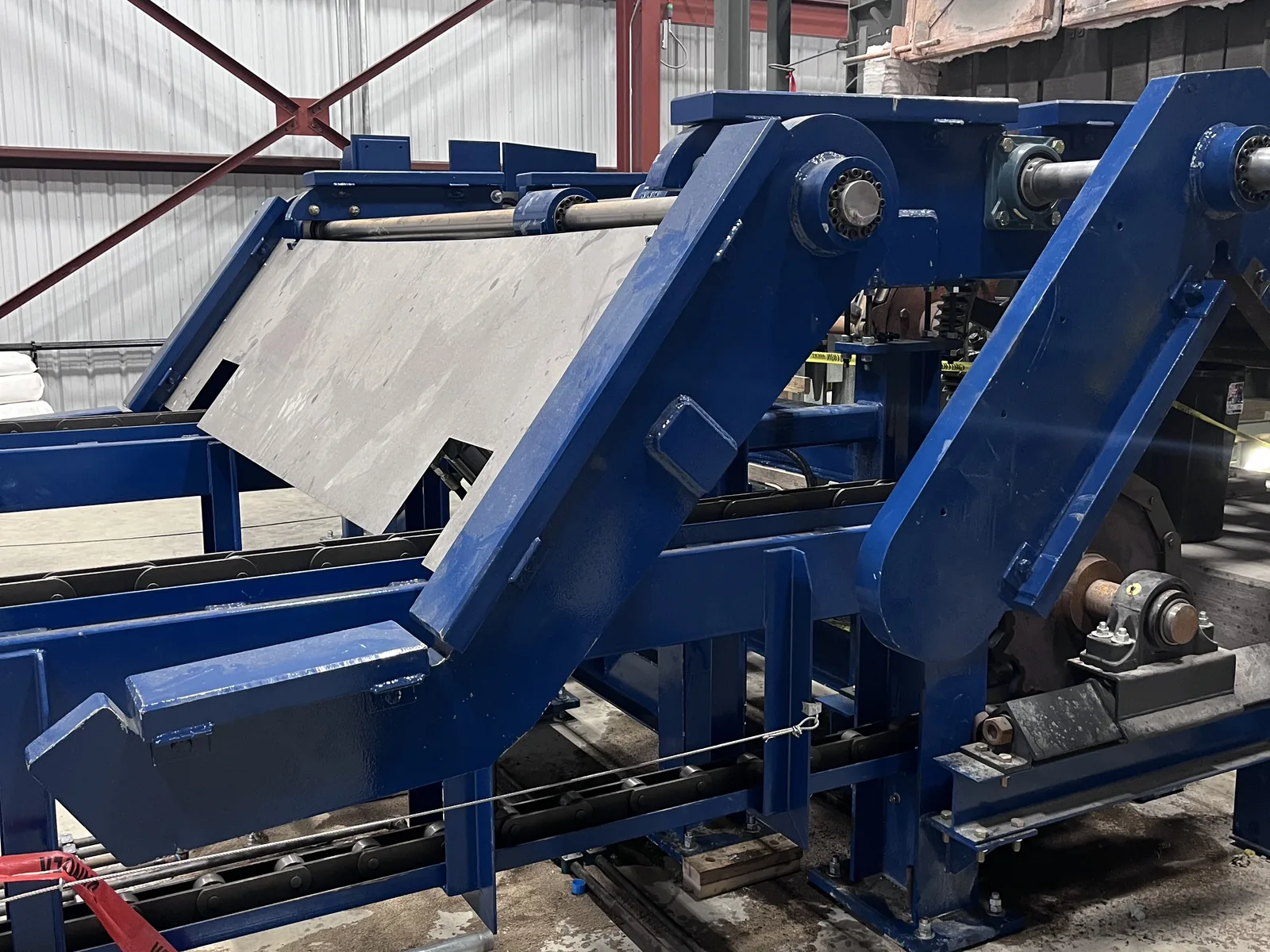 Custom conveyor machinery inside a fabrication shop