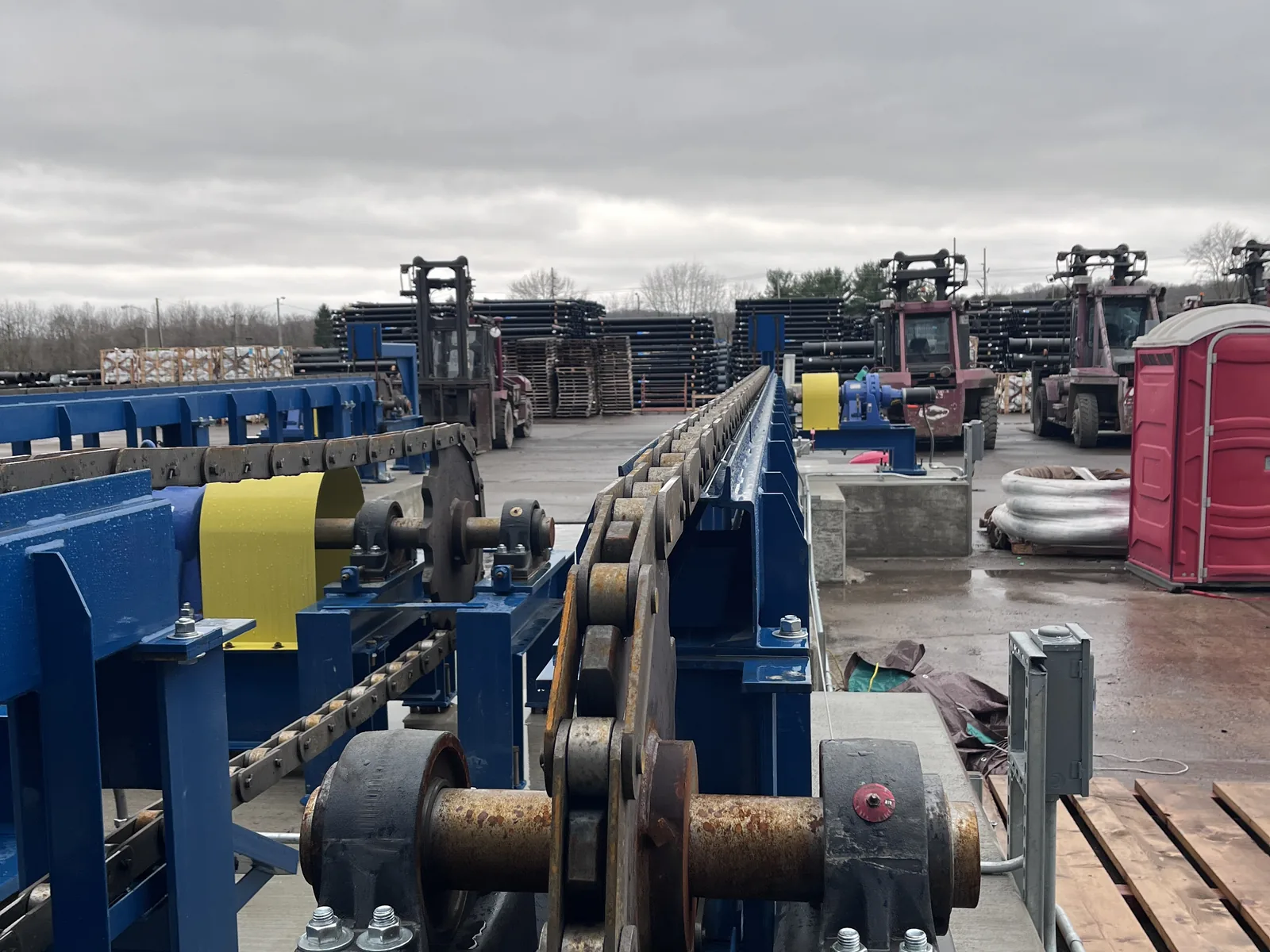 Heavy machinery staged in a fabrication yard